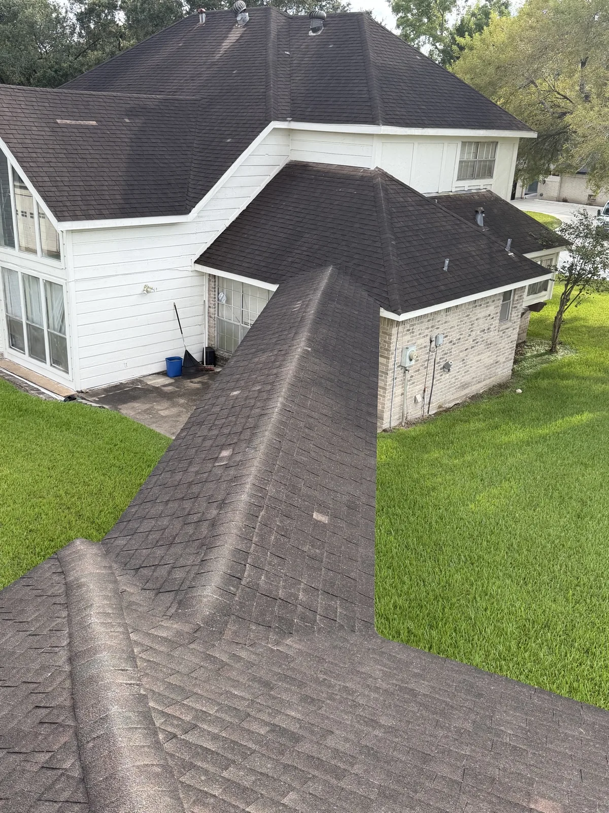 House and roof before repair work in Sugar Land