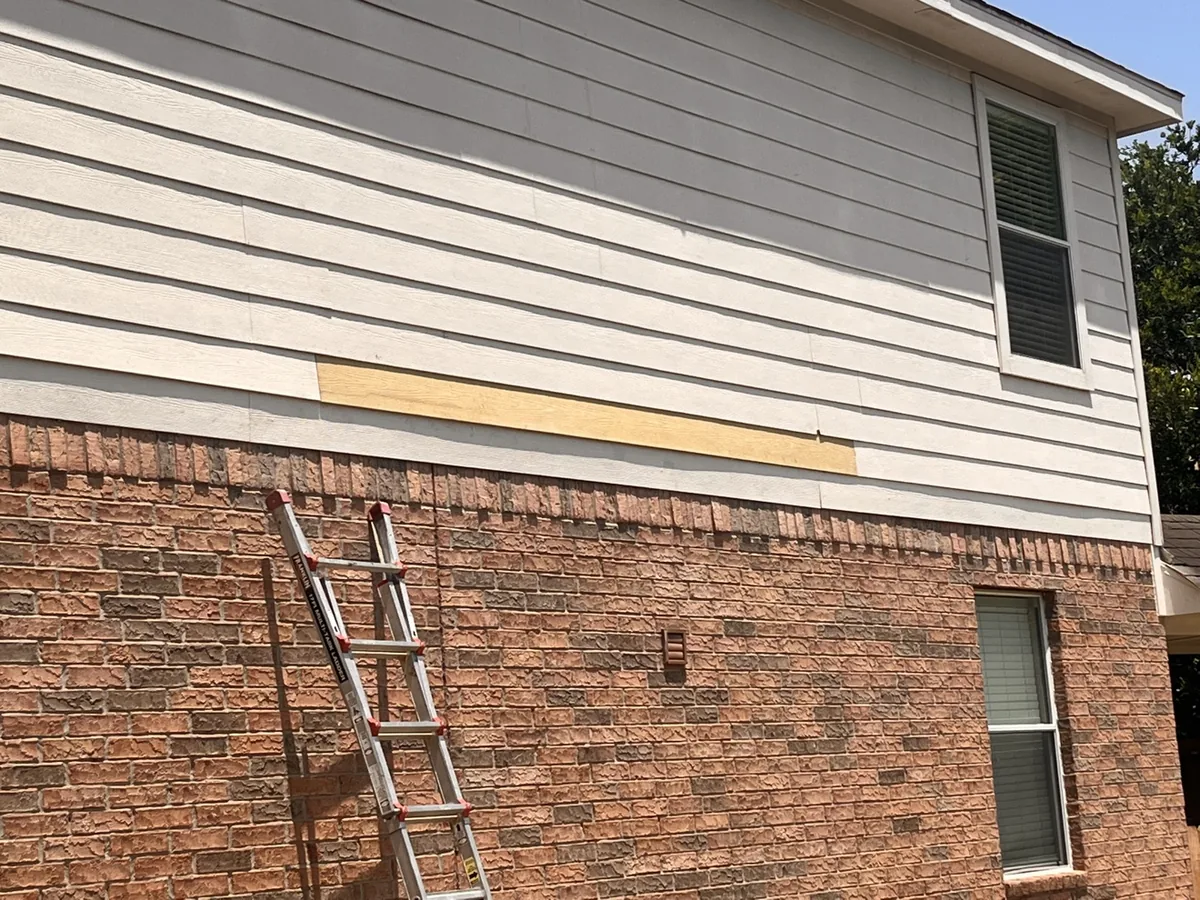 New primed James Hardie board installed in place of the damaged boards